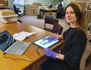 Local Studies Librarian Heather with glass negatives